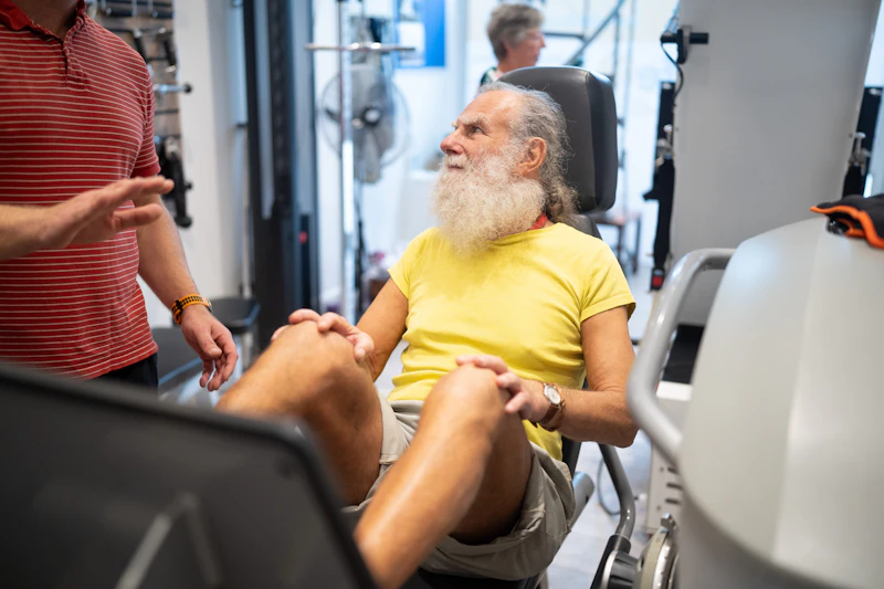 Senior doing rehabilitation exercises after a joint replacement surgery to rebuild strength