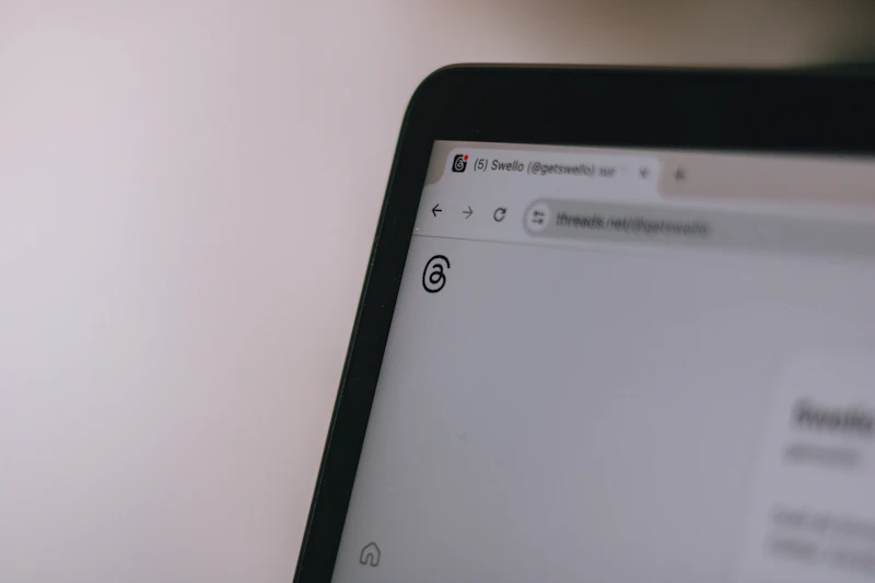 Person inspecting a suspicious email on a laptop screen, learning to spot phishing attempts