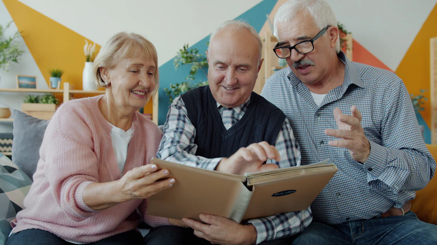 Three seniors looking at a photo album and laughing together, representing social connection and brain health