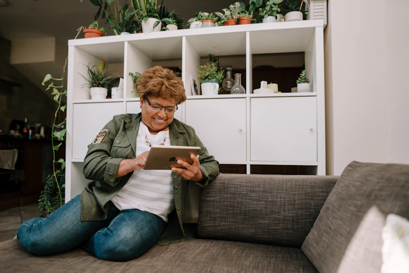 Senior on a video call with family members, staying connected with loved ones who live far away
