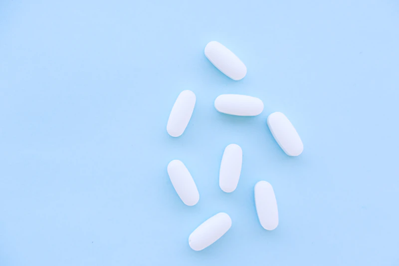 Vitamin D and calcium sources including dairy, sardines, eggs and supplement capsules for senior bone health