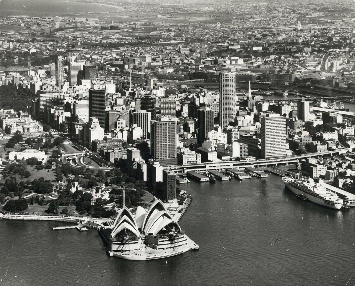 Aerial view of Sydney Harbour in the 1960s with the Opera House under construction